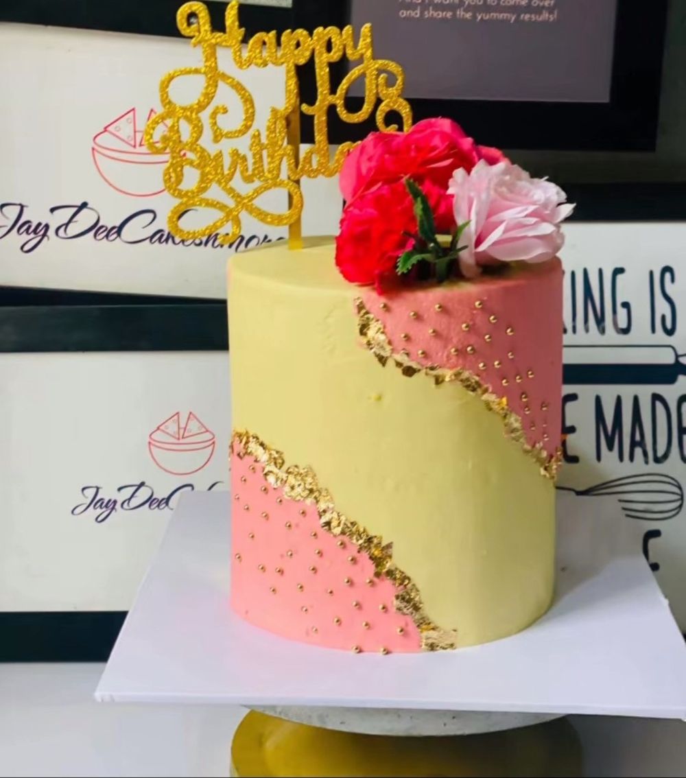 JayDee birthday cake in buttercream and pink with gold leaf and fresh roses